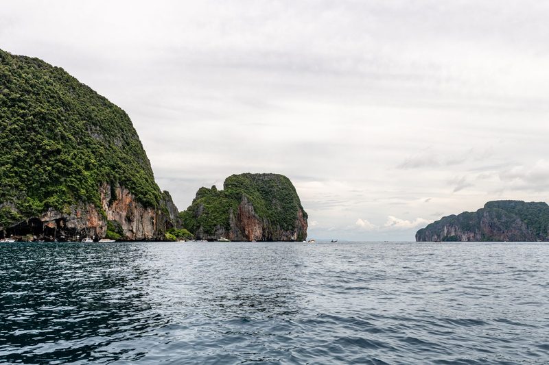 Phuket, Thailand - Explore the breathtaking limestone cliffs and serene sea in Phuket, Thailand.