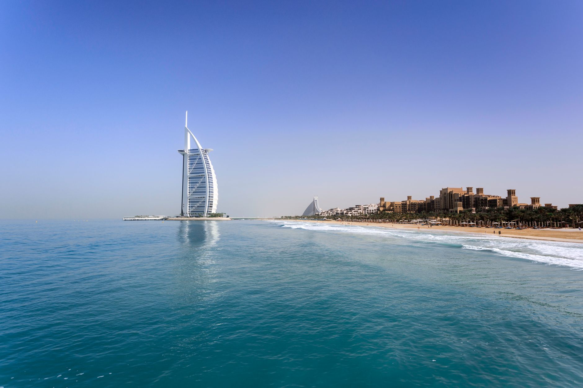 Dubai - Iconic Burj Al Arab overlooking the pristine Dubai beach, perfect for travel and