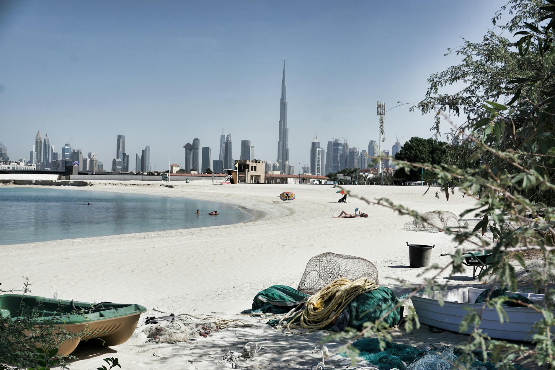 Dubai - Scenic view of Dubai's skyline with the iconic Burj Khalifa from a serene beach 