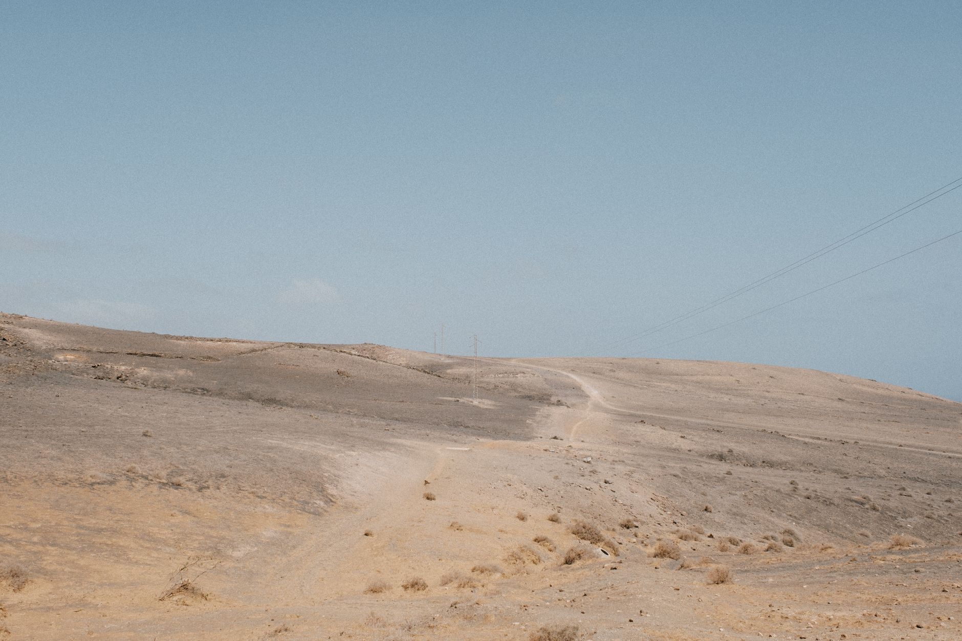 Lanzarote - A barren landscape in Lanzarote, Spain under a bright, clear blue sky. Ideal for