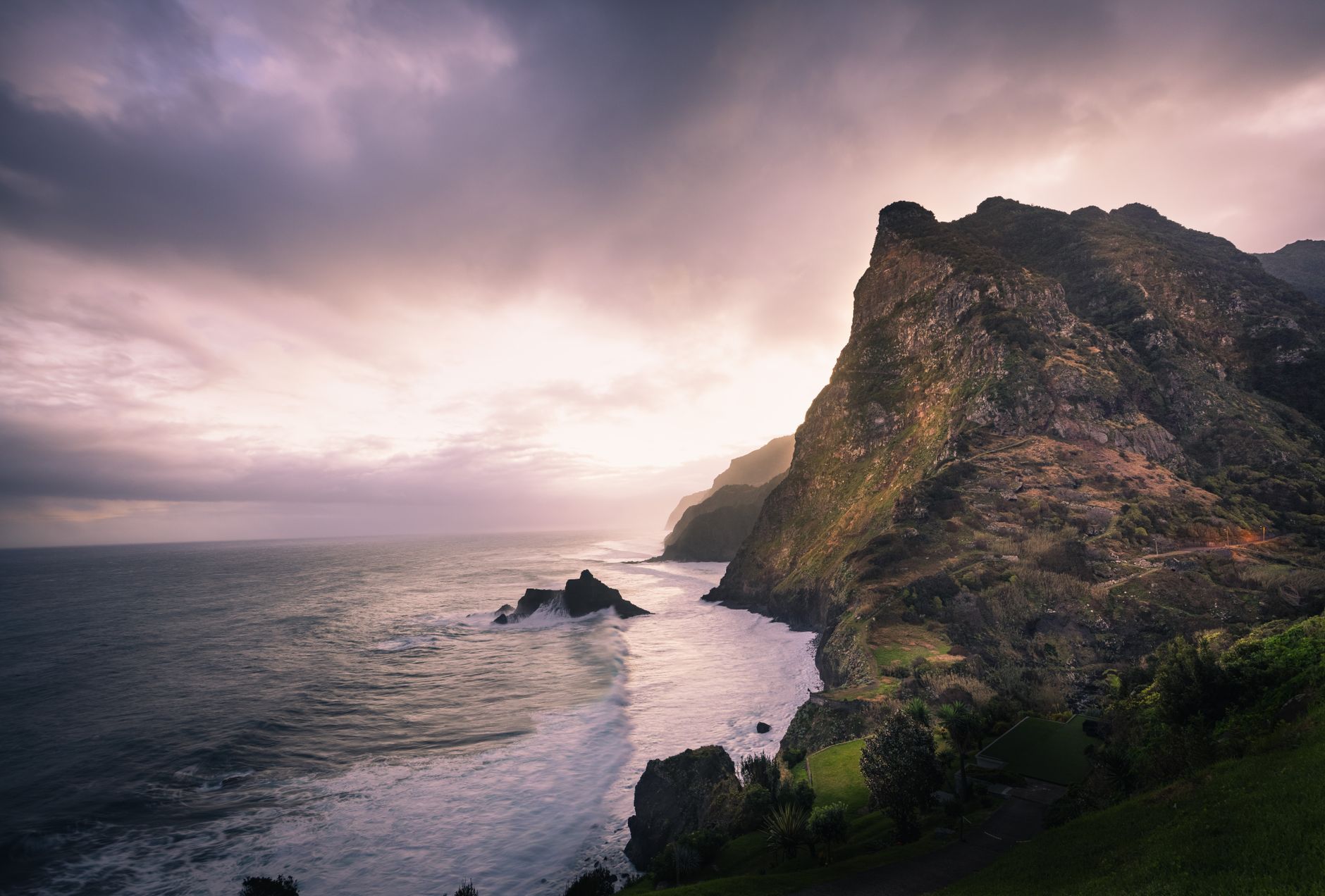 Madeira - Breathtaking view of Madeira's rugged coastline with cliffs illuminated by the s