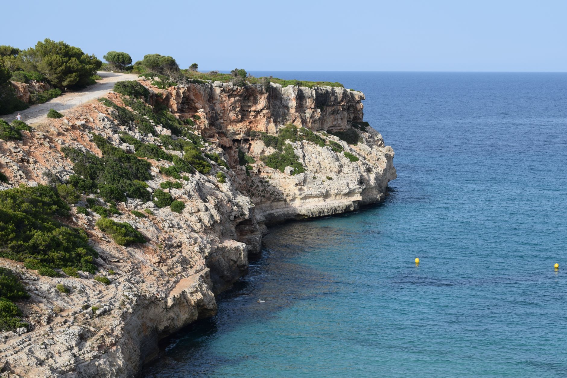 Mallorca - Breathtaking view of cliffside and turquoise sea along the Mediterranean coast.