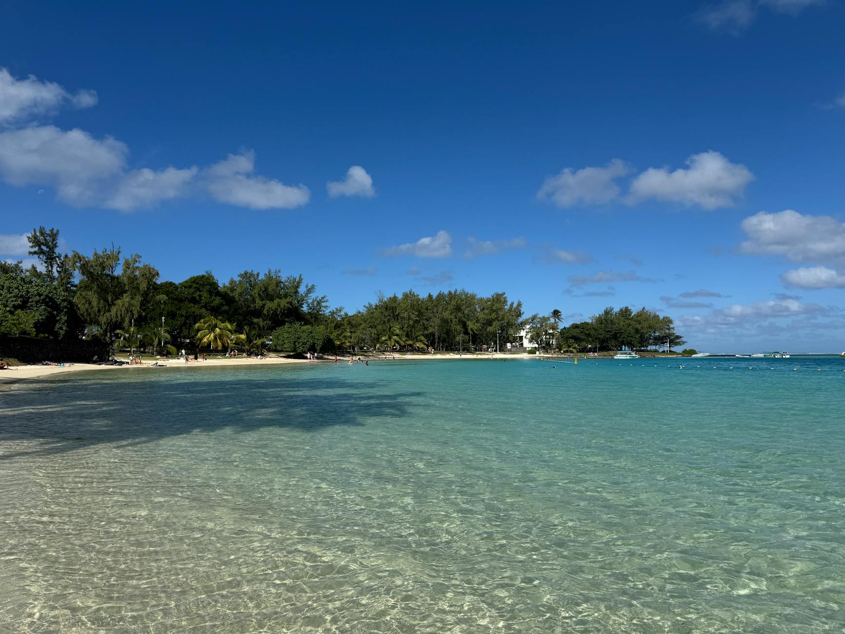 Mauritius - Pristine beach in Blue Bay, Mauritius with clear blue water and a sunny sky.
