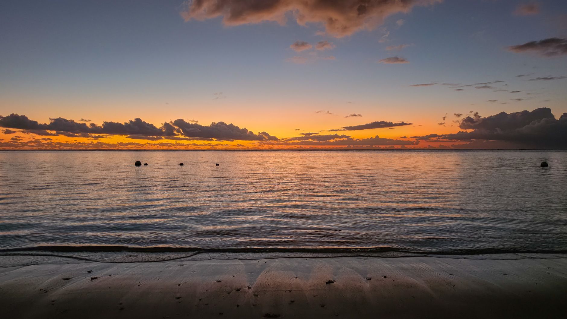 Mauritius - A breathtaking sunset view over the serene waters and sandy beach of Mauritius' 