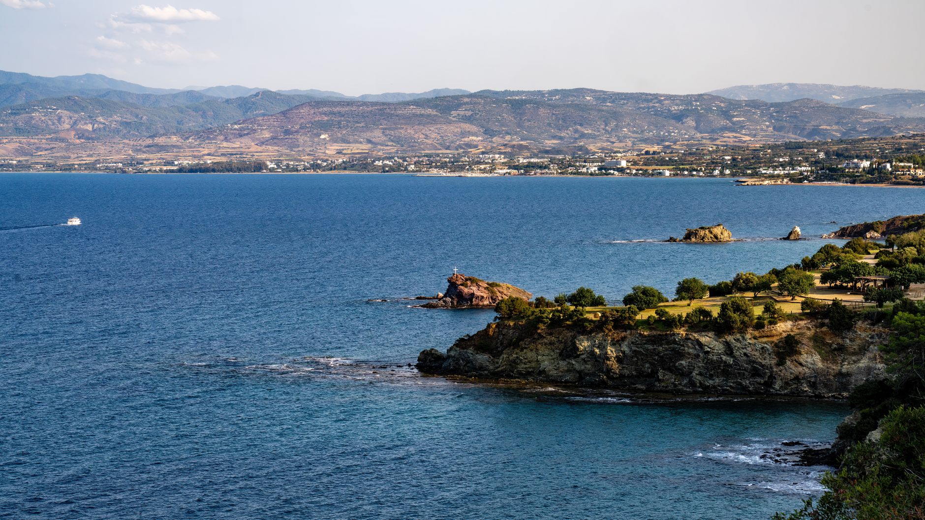Rhodos - Breathtaking view of a rocky coastline with expansive blue sea under a clear sky