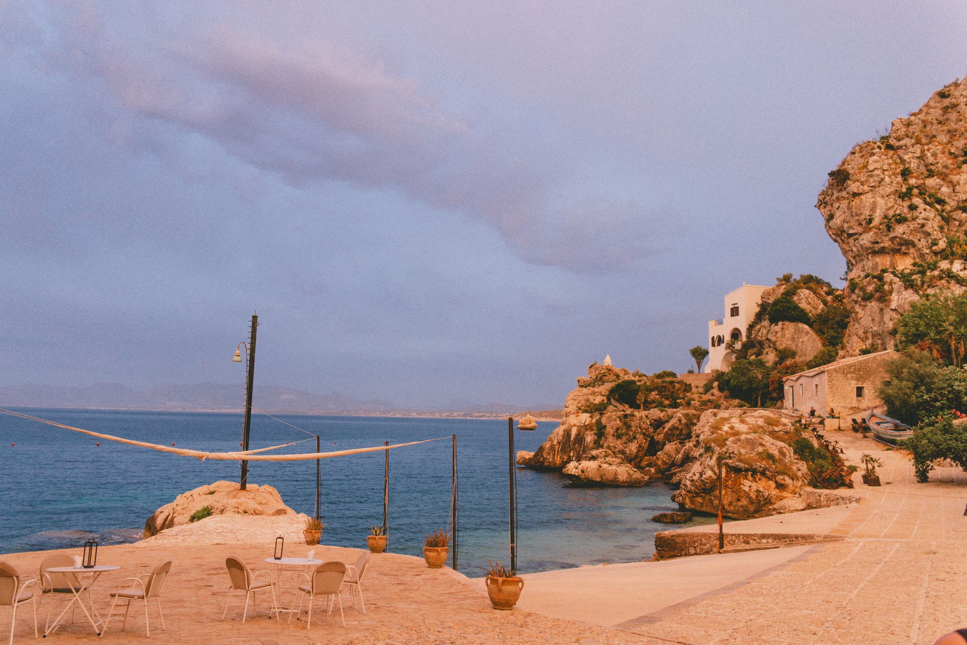Sizilien, Italien - Explore the serene rocky coastline of Scopello, Sicily, with empty beaches at su