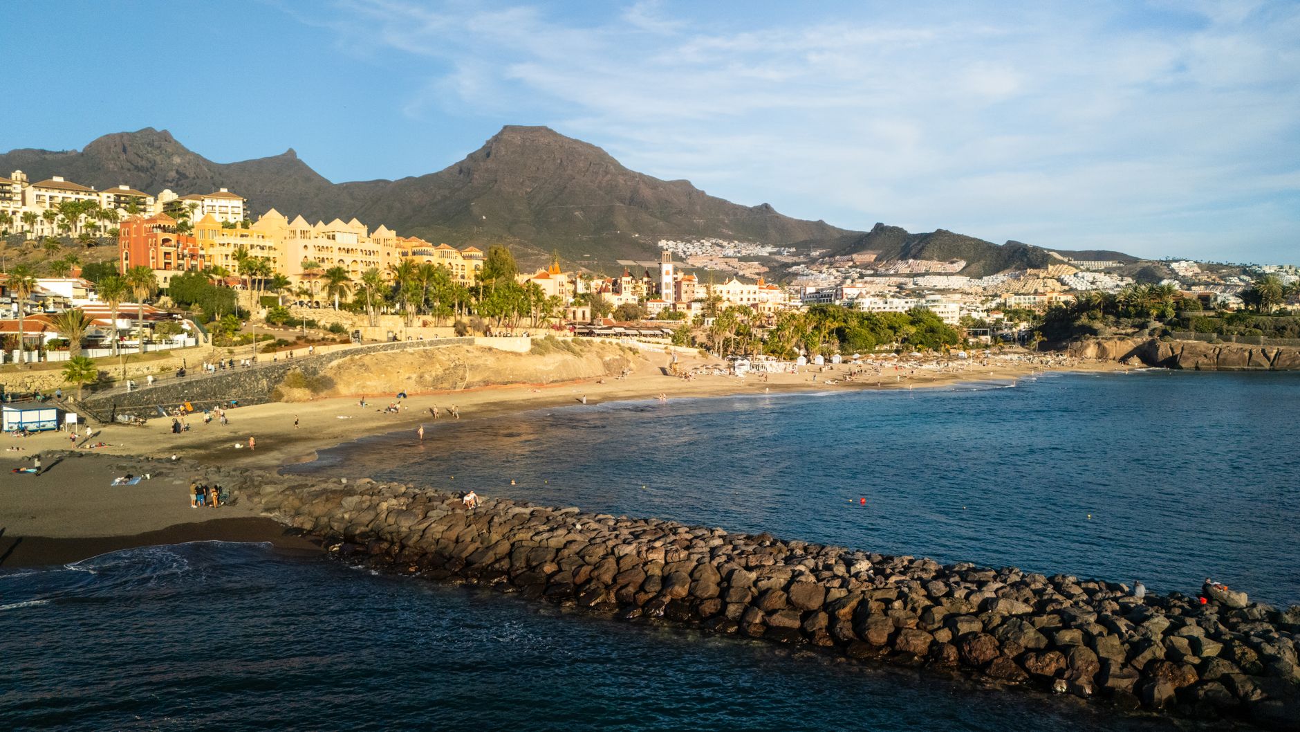 Teneriffa - Scenic aerial view of Costa Adeje beach and town in Spain during sunset.