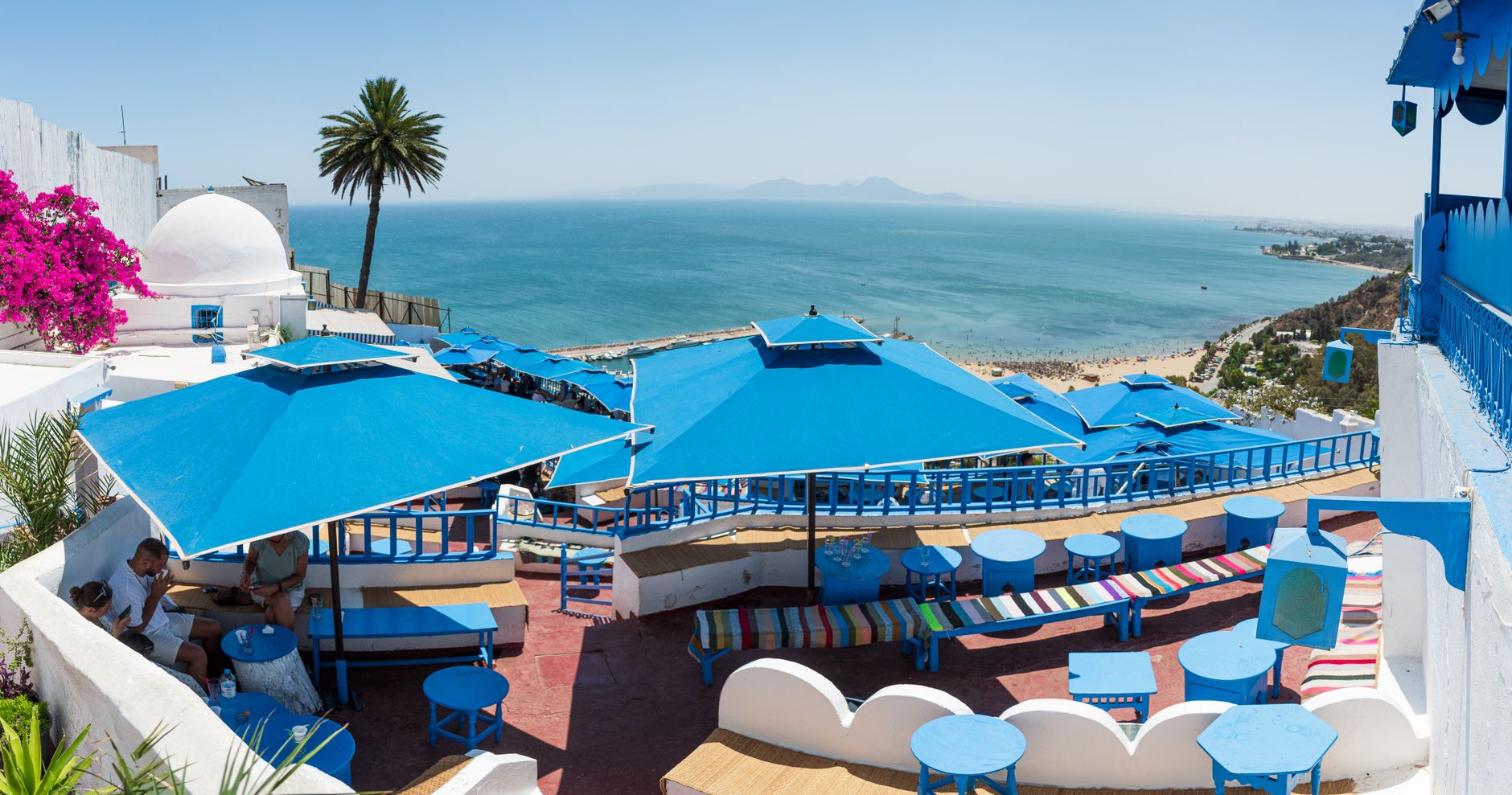 Tunesien - Discover a colorful seaside terrace in Carthage, Tunisia, offering stunning Medi